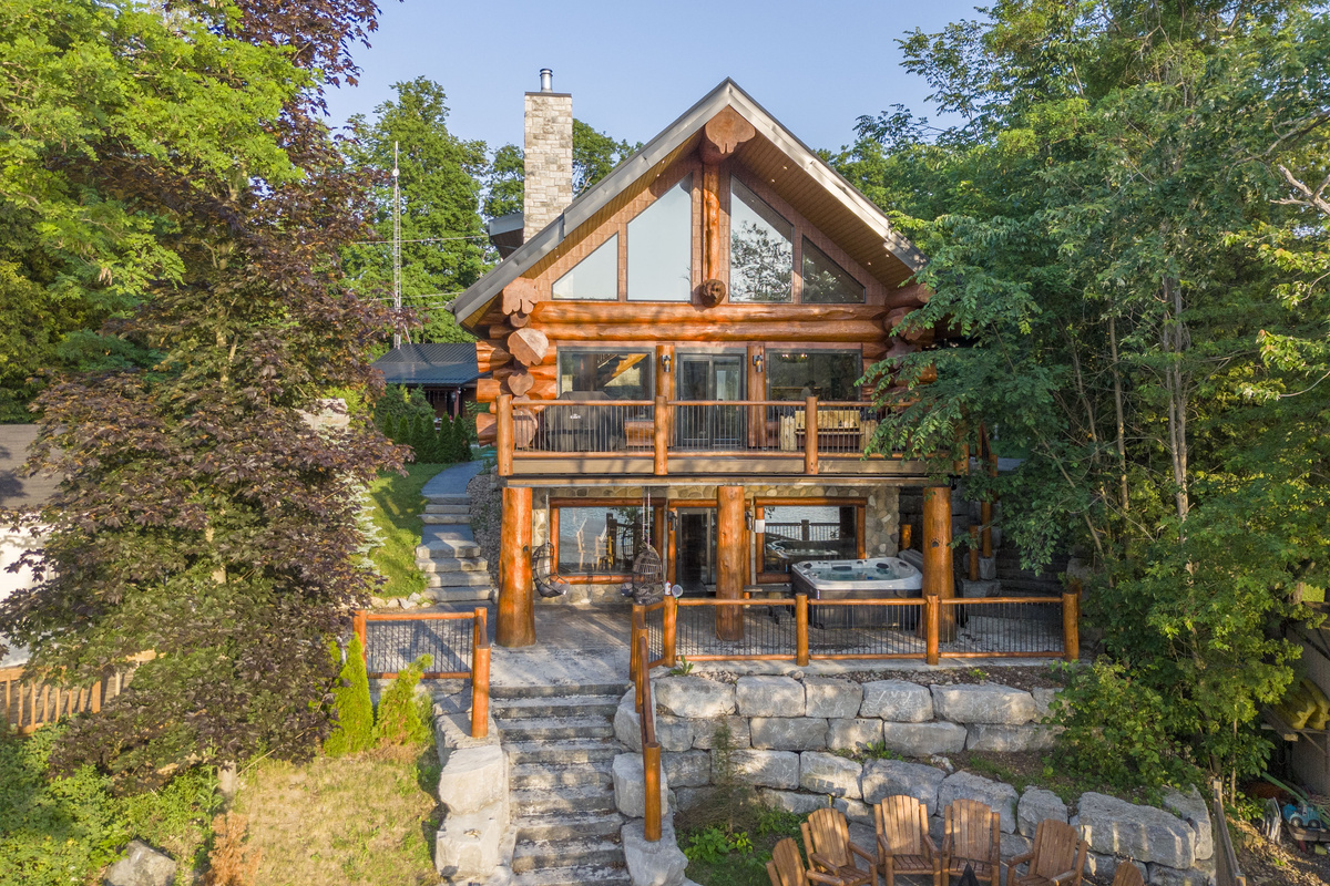 Waterfront-facing exterior of Bear Lodge surrounded by trees