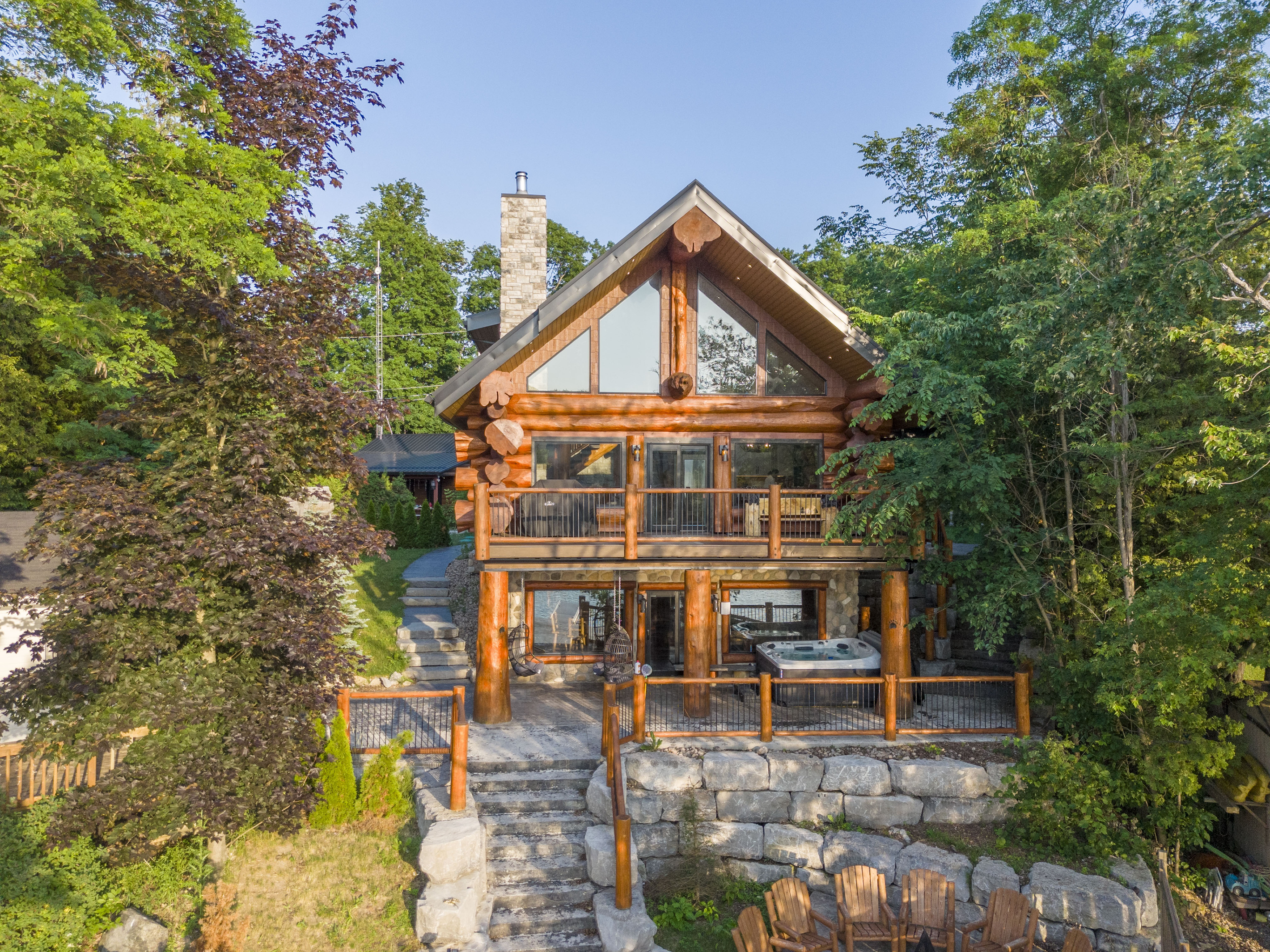 Waterfront-facing exterior of Bear Lodge surrounded by trees
