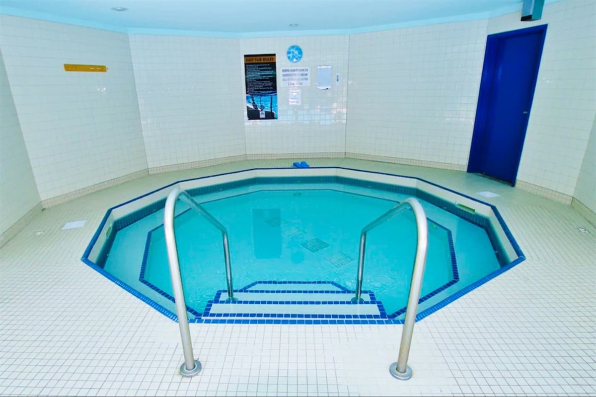 Large Hot Tub in shared pool area, covered from above, open onto the pool area.  Change room.  