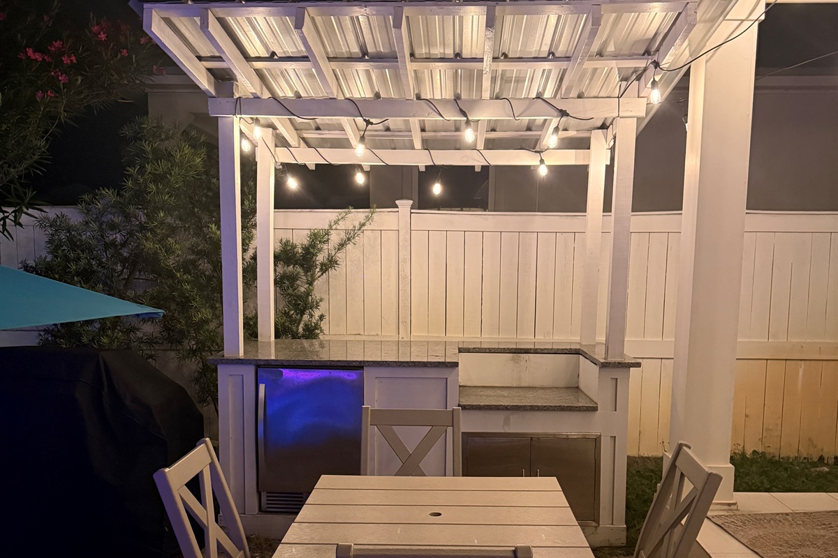 Outdoor dining area with string lights—perfect for evening meals.