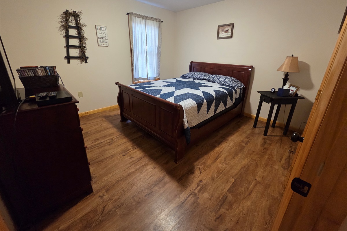 Master bedroom with a queen bed