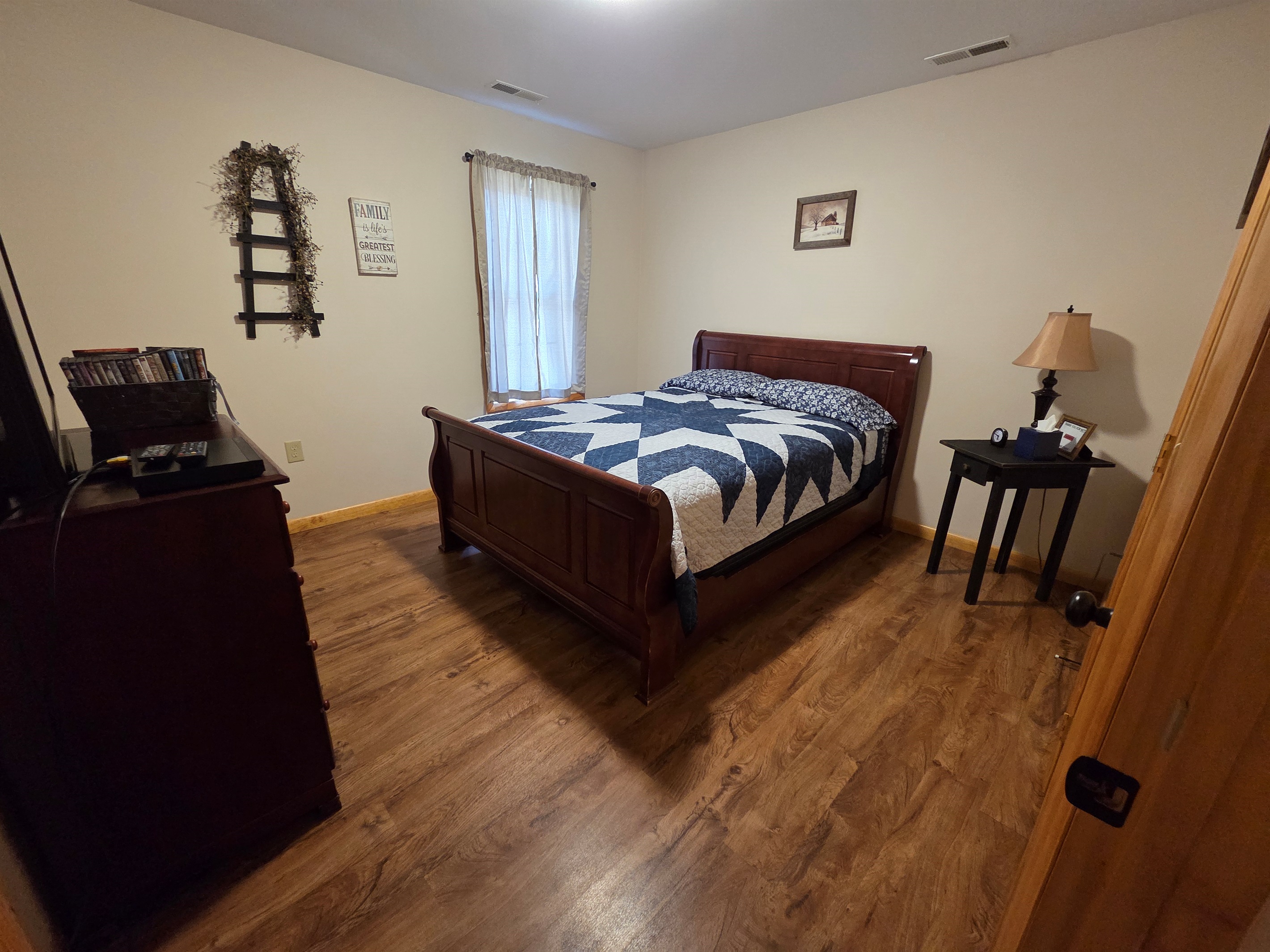 Master bedroom with a queen bed