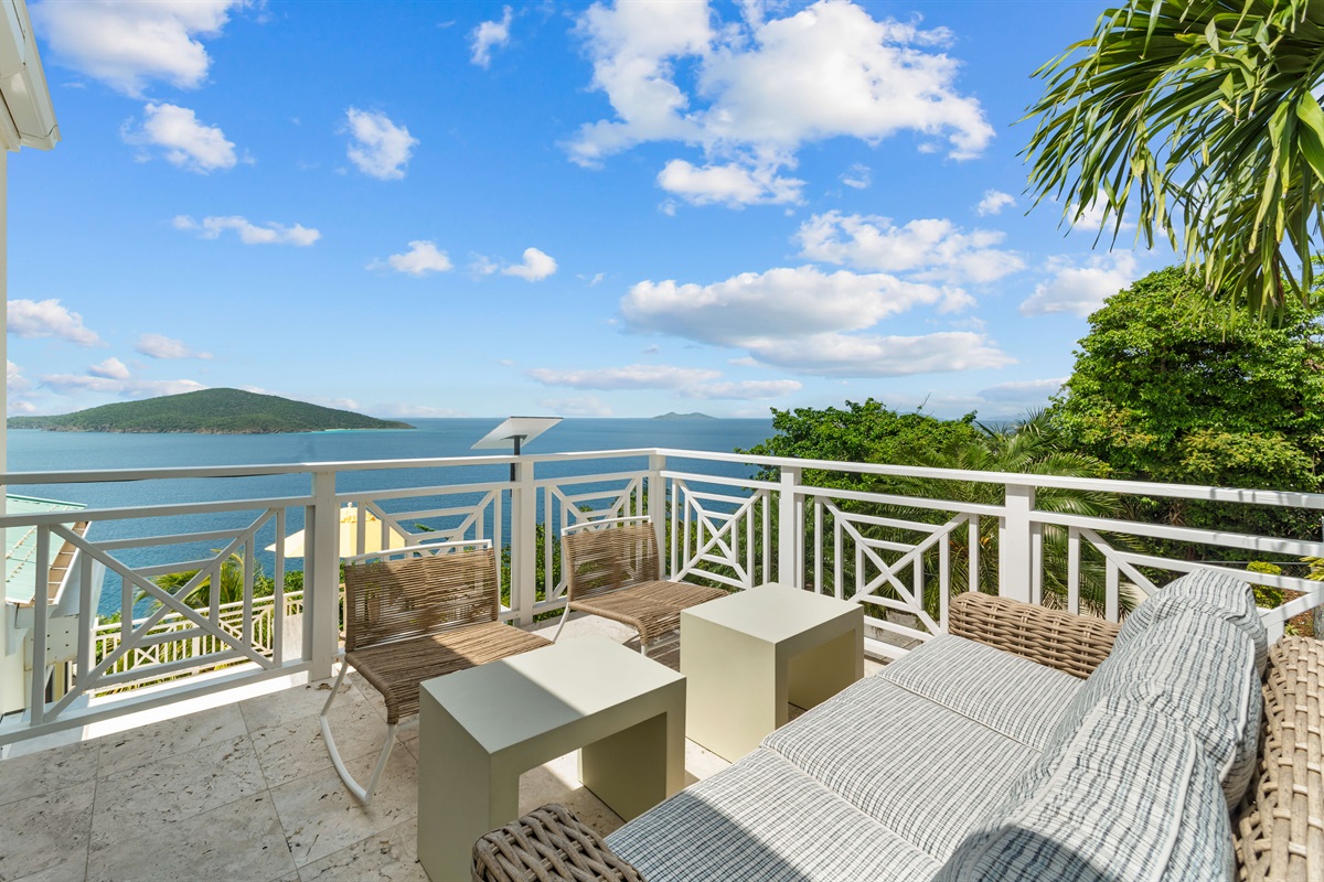 Upper-level balcony with panoramic ocean views, ideal for coffee at sunrise or nightcaps under the stars.