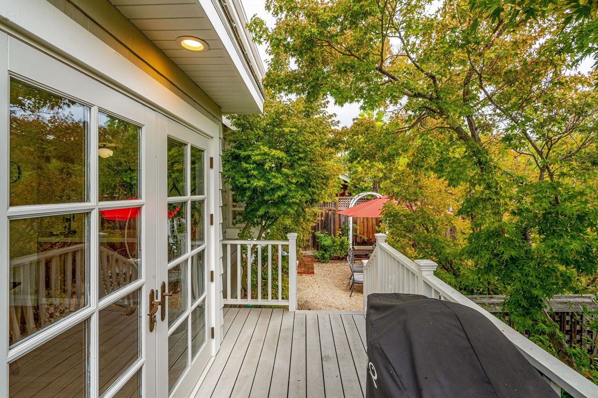 Barbeque deck and steps down to terrace