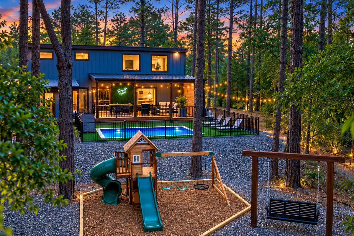 Made for adventurers, with a resort-style pool, playset plus TWO swing areas where adults can relax, watch the littles play, and look out over the peaceful fishing pond, all under the pines and just steps from the pickleball/basketball court & cinema.