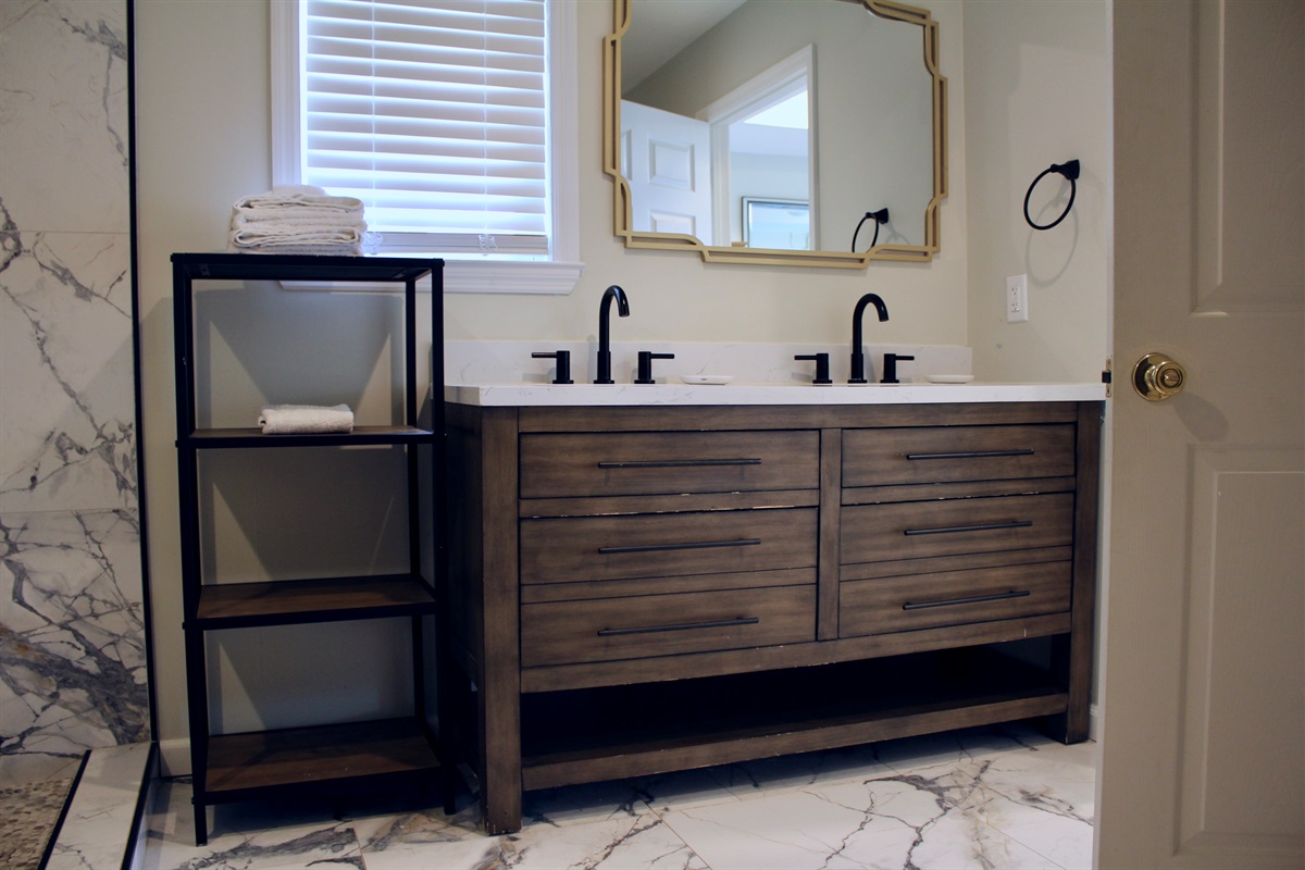 A thoughtfully designed bathroom with dual vanities, perfect for couples or families on the go.