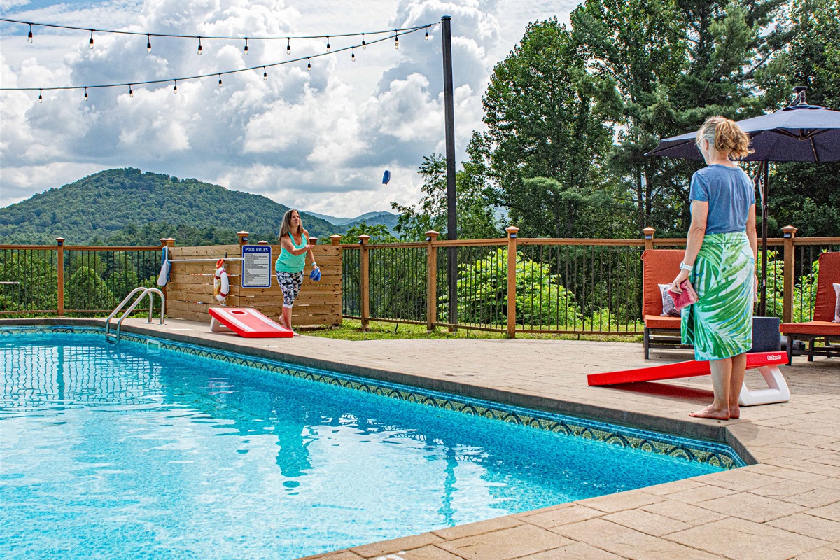 🌽🎯 Challenge friends and family to a game of cornhole by the pool — a little friendly competition with a mountain view backdrop! 🏔️☀️