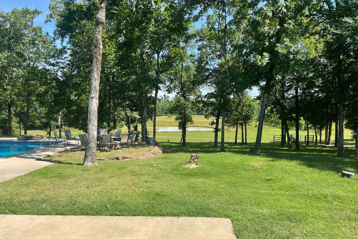 Relax in the living room while the pond and pool are in full view.