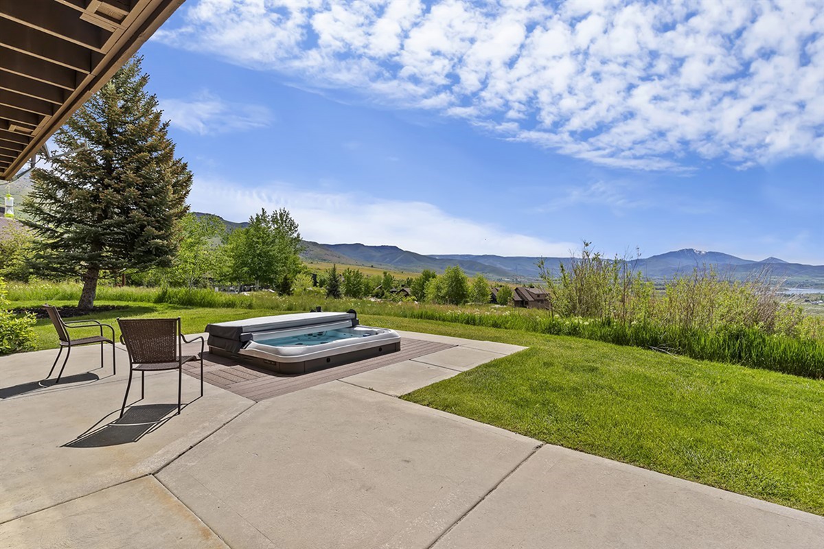 Soak under the open sky with panoramic mountain views all around