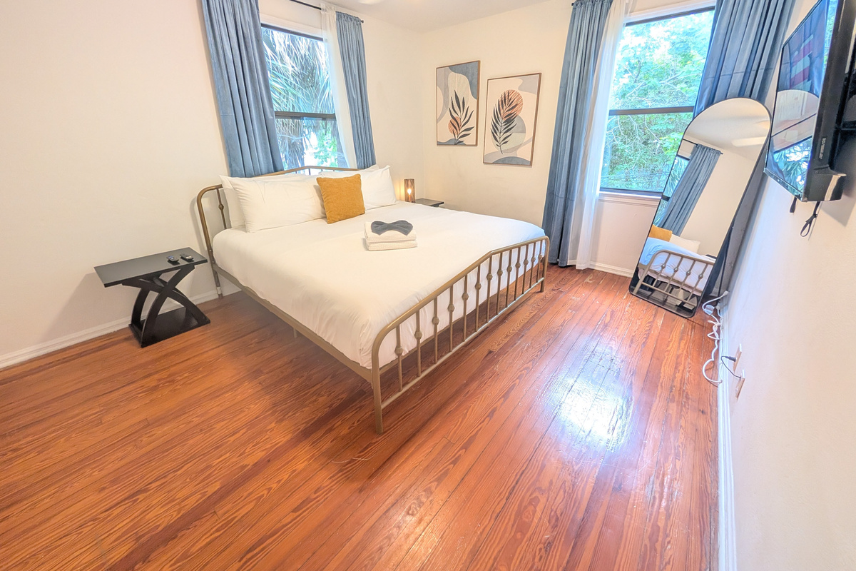 Master bedroom with king bed and smart TV