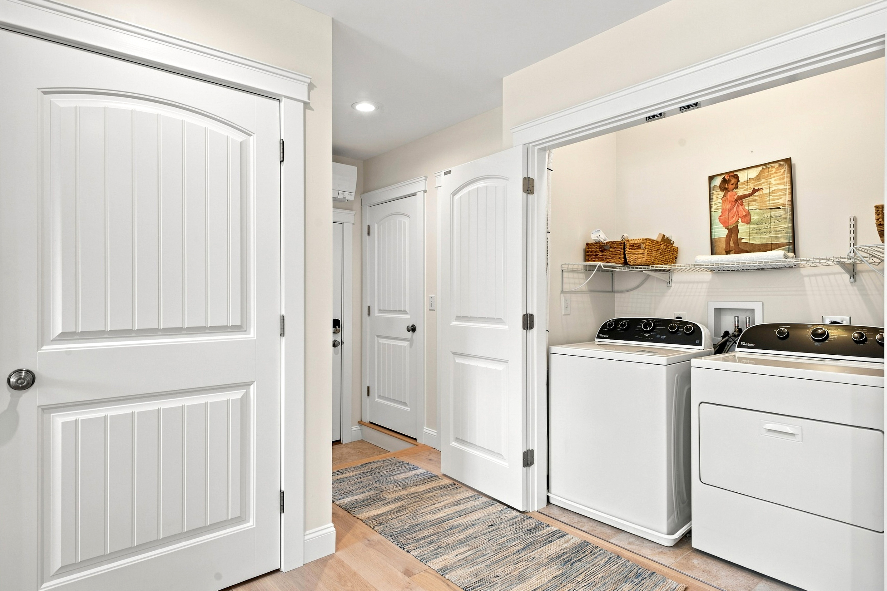 A dedicated laundry area with washer and dryer adds extra convenience for longer stays and beach days.