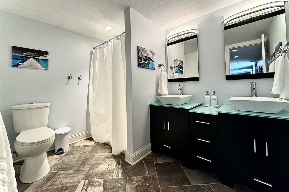 Spacious double vanity and walk-in shower in the Garden Level Double Bathroom.