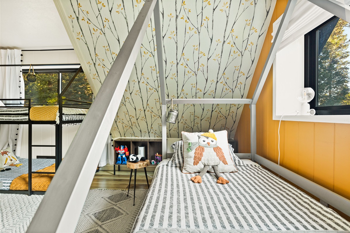 Bedroom 4: The twin bed features convenient pull-out drawers, transforming it into a spacious king-size bed when needed.
