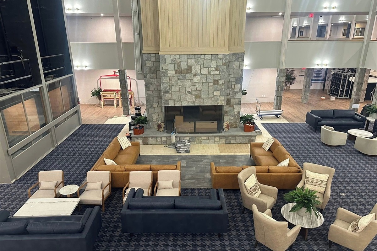 The newly remodeled lobby features a giant double-sided fireplace and new sofas