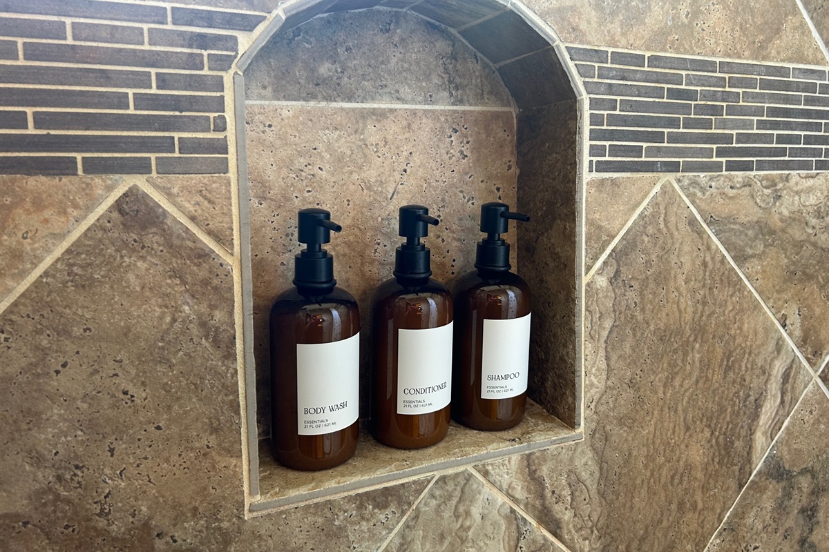 "Hotel-Style Amenities Await" Our bathrooms are stocked with quality shampoo, conditioner, and body wash dispensers—everything you need for a refreshing stay!