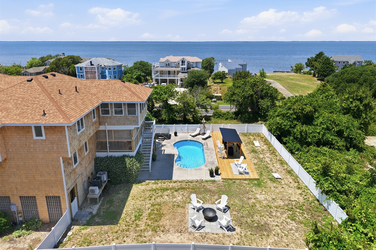 Aerial view of the home, private pool, and nearby sound views