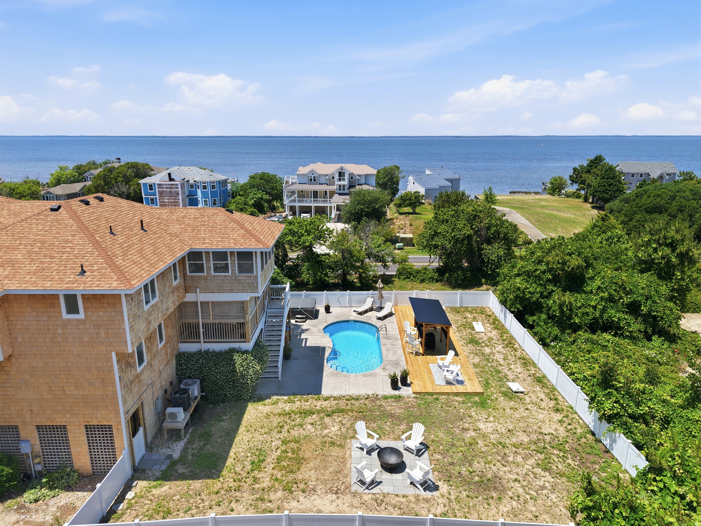 Aerial view of the home, private pool, and nearby sound views