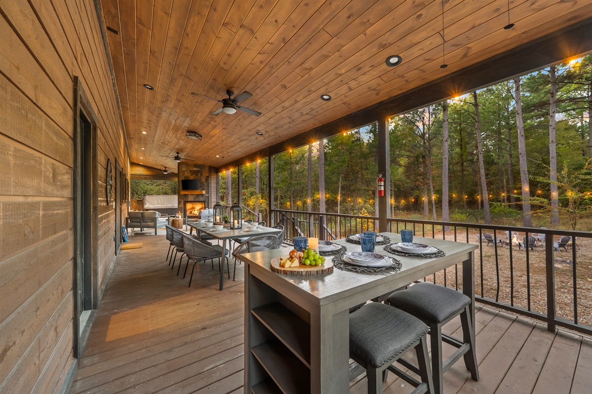 Dinner on the deck feels effortless here. Generous seating, warm lighting, and forest views create the perfect backdrop for family time.