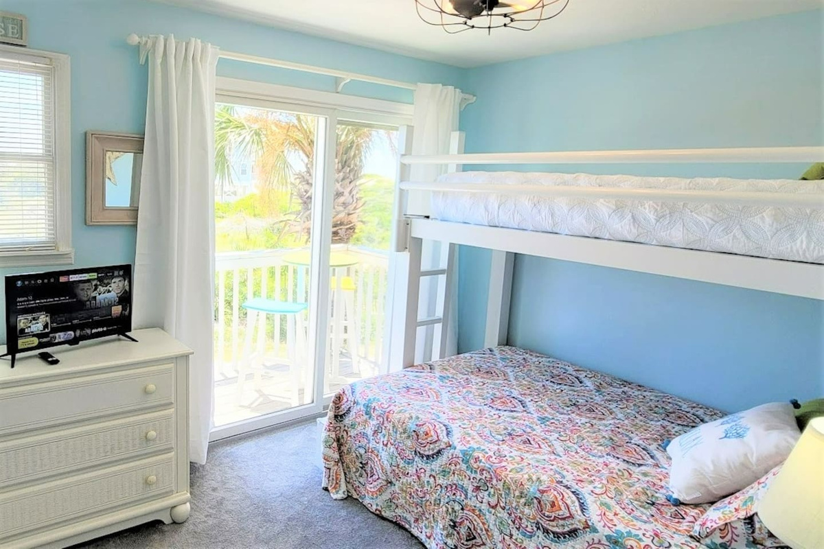 The main level queen bedroom has its own private balcony &mdash; your own quiet space when the rest of the group is loud.