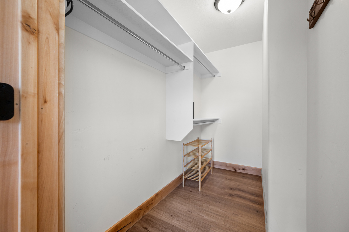 Convenient bedroom storage gives guests space to unpack and settle in during longer stays.
