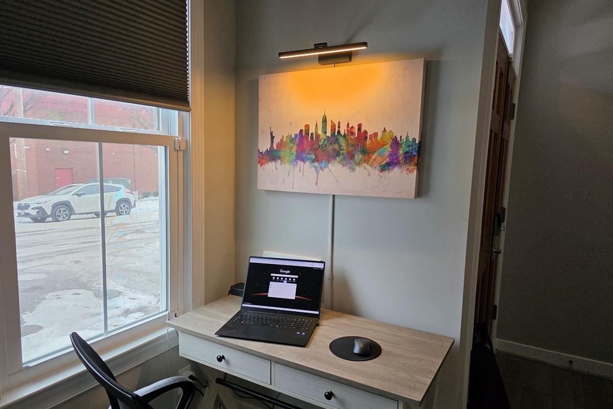 Living Room: Work Station with picture light. To turn on ask "Alexa, turn on Desk" and "Alexa turn off Desk"