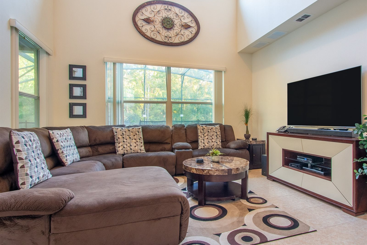 Comfortable U-sectional, entertainment center with large screen TV, expanded cable included!