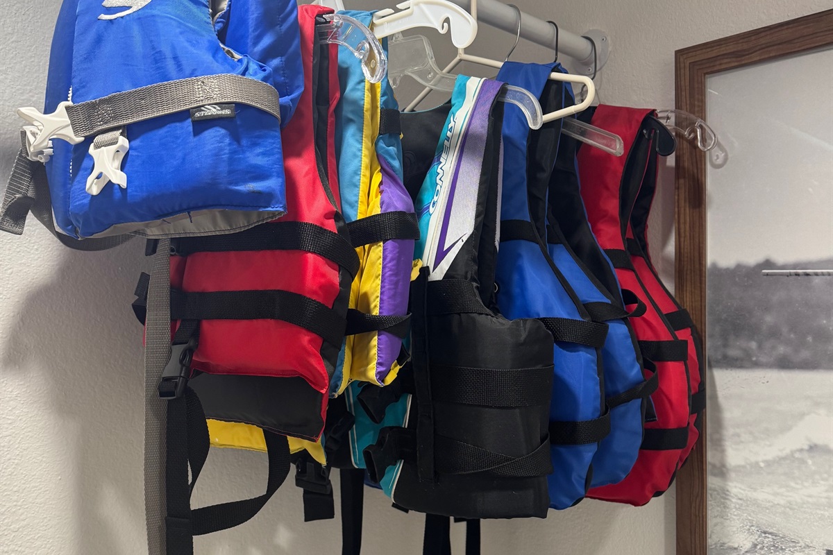 8 lifejackets of various sizes in laundry room