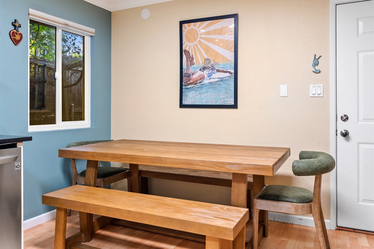 Gather around this spacious wooden table for shared meals.