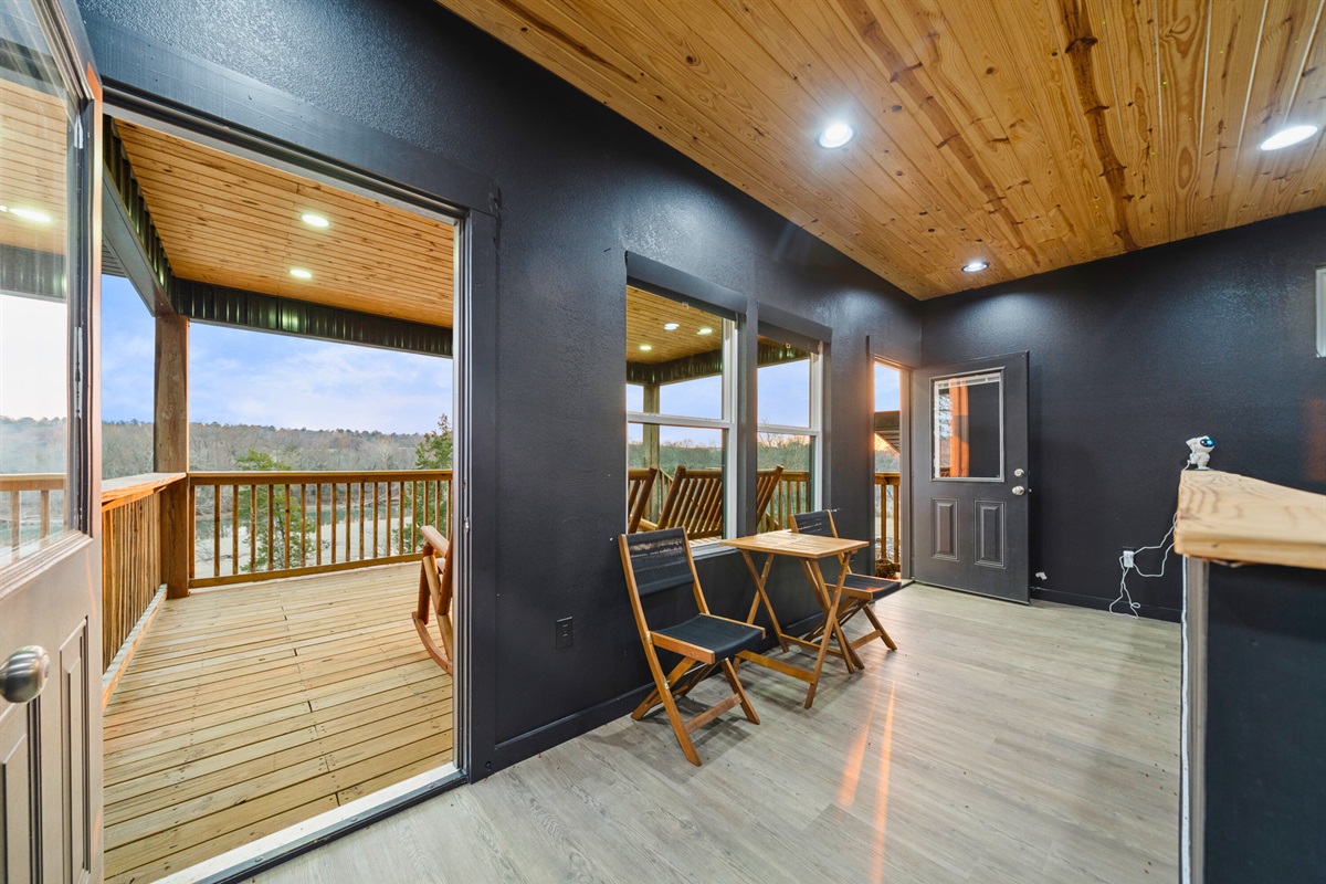 Step outside onto the covered patio where comfortable seating invites you to relax and take in the surrounding views.