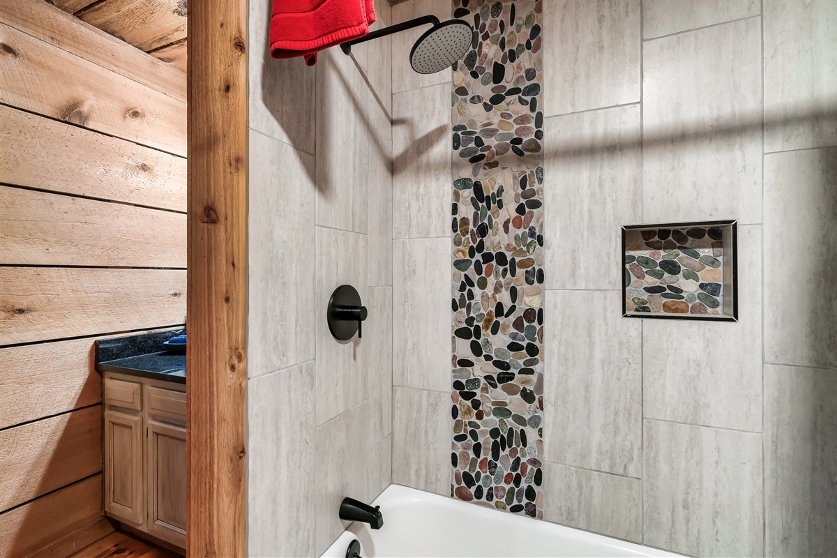 Fresh tile and a rain shower to wash off the trails