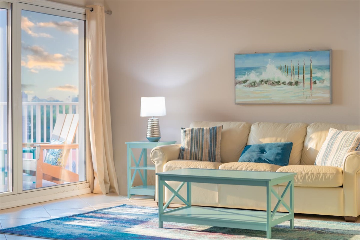 Huge open cozy living room with 70-inch LED Smart TV, Fireplace and Gulf Views