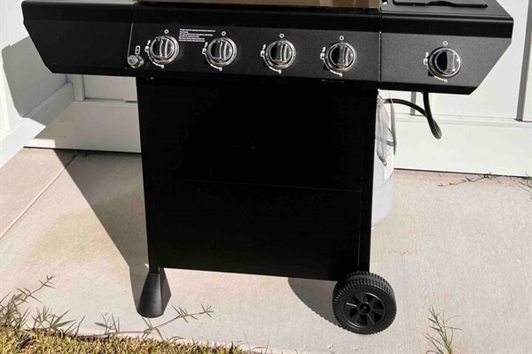 Propane grill with side burner.