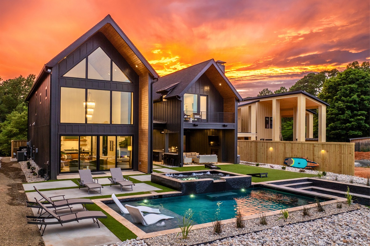 Our property at sunset is a sight to behold, with a perfect blend of natural beauty and sophisticated architecture.