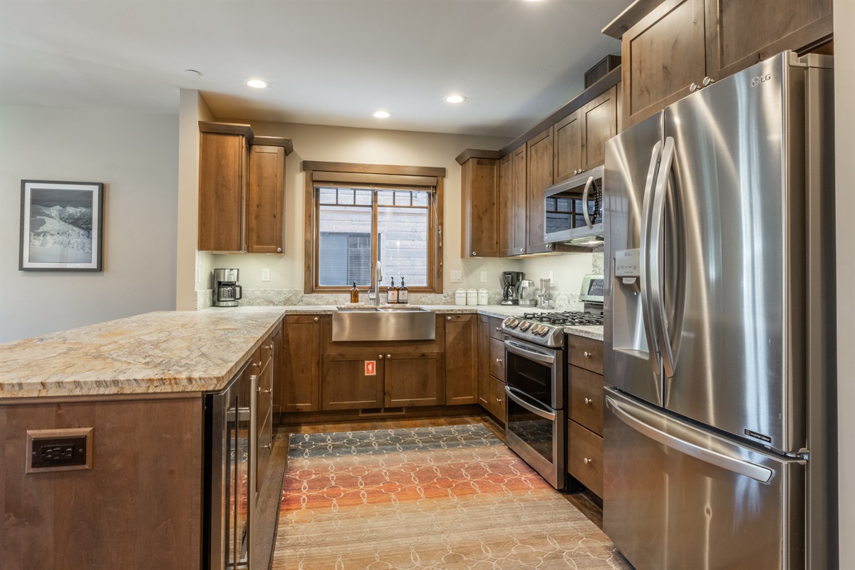 A fully equipped, spacious kitchen with generous prep space and modern appliances — built for group meals and relaxed mornings.