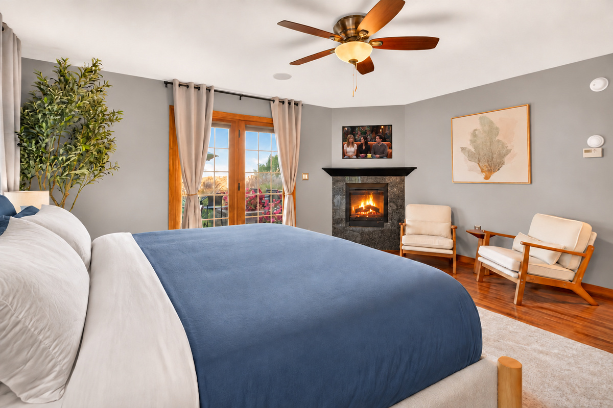 Bedroom with fireplace and adjacent sitting area
