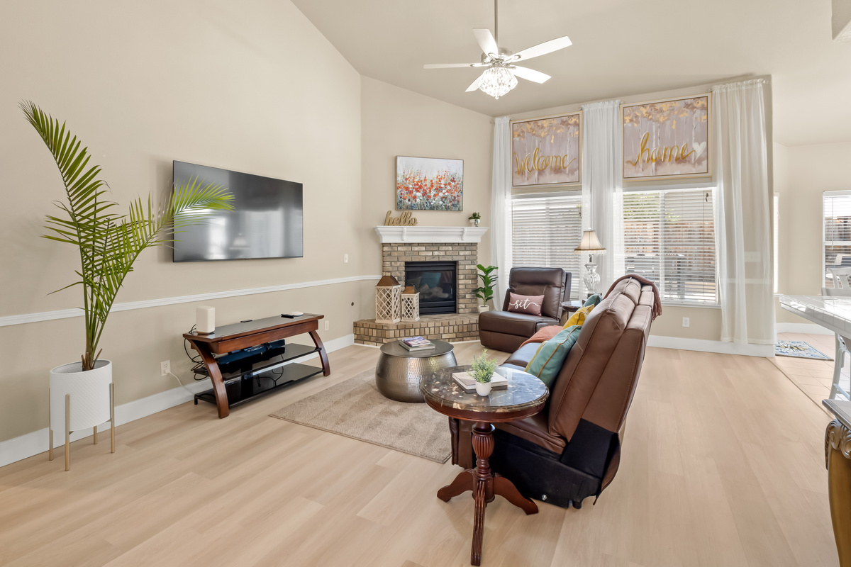 Gather together in this bright and spacious living room. Whether you're watching a movie, enjoying conversation, or simply relaxing, this welcoming space is designed for making memories.