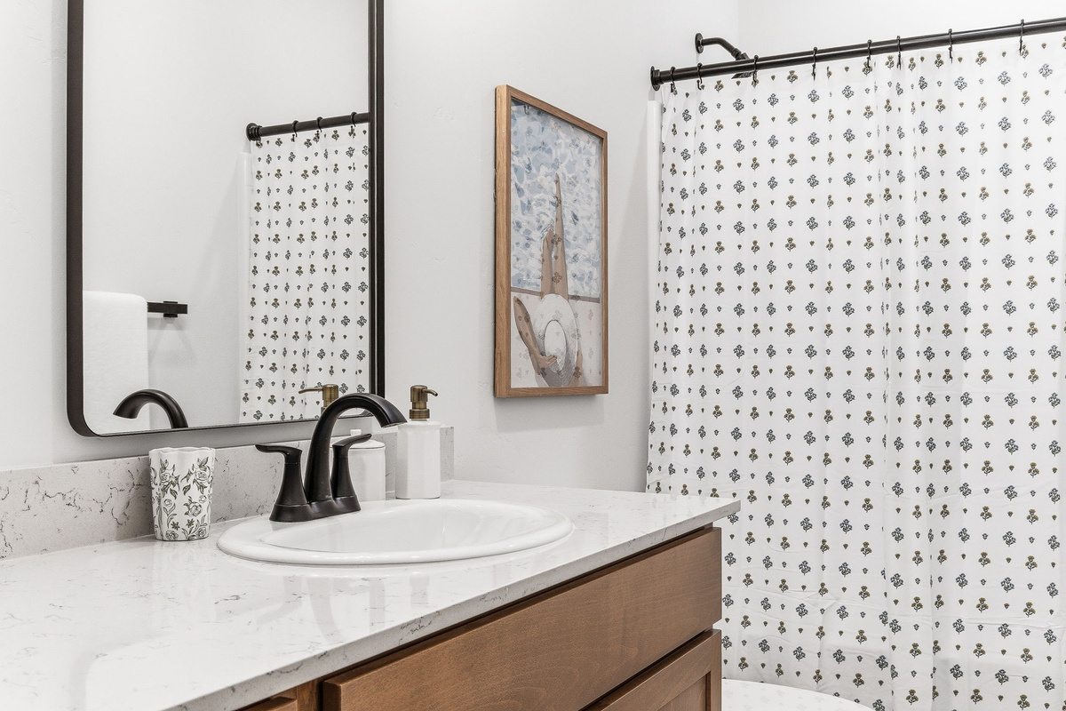 Bright lighting, plenty of counter space, and modern finishes make getting ready effortless, whether you're heading out or winding down.