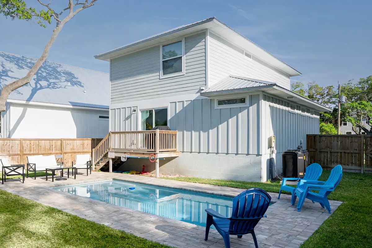 Pull into the drive, drop your bags, and feel vacation begin—coastal charm out front, your own private pool waiting out back, and a fenced yard made for sun-soaked afternoons, easy family time, and nights that stretch a little longer.