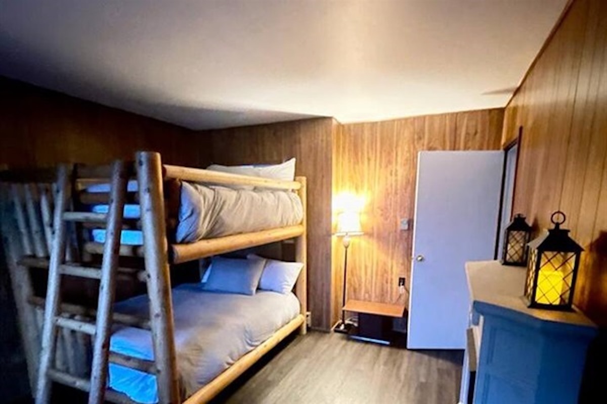 Bunk bedroom with multiple sleeping spaces