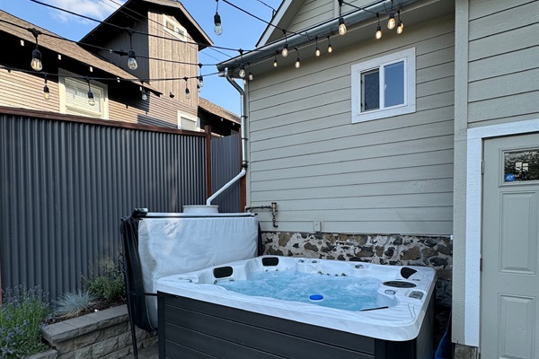 Enjoy dining outdoors on the patio in the fully fenced backyard. Then soak in the hot tub for maximum relaxation!
