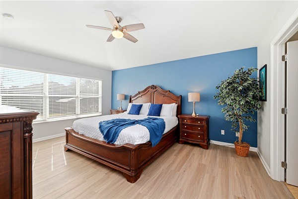 Primary suite one with full sized crib