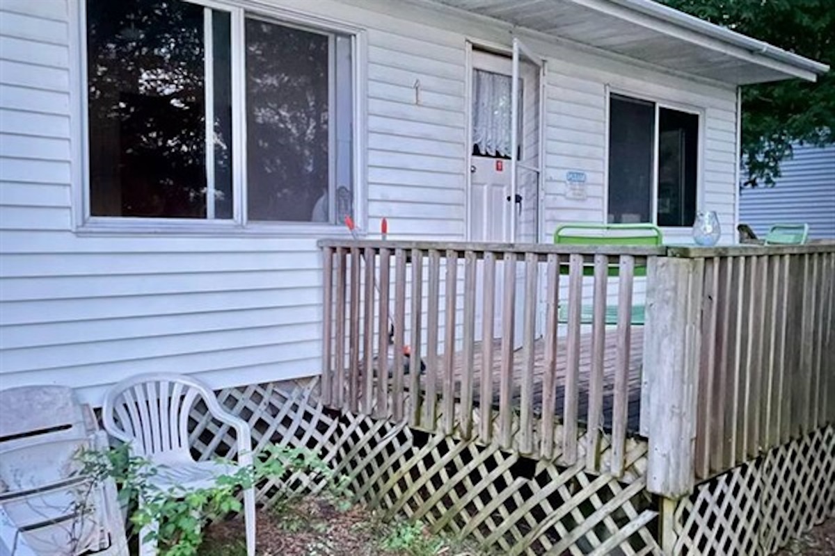 Exterior entrance and private deck at Cottage #1
