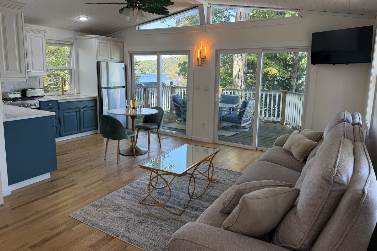 Open living/dining/kitchen and deck beyond