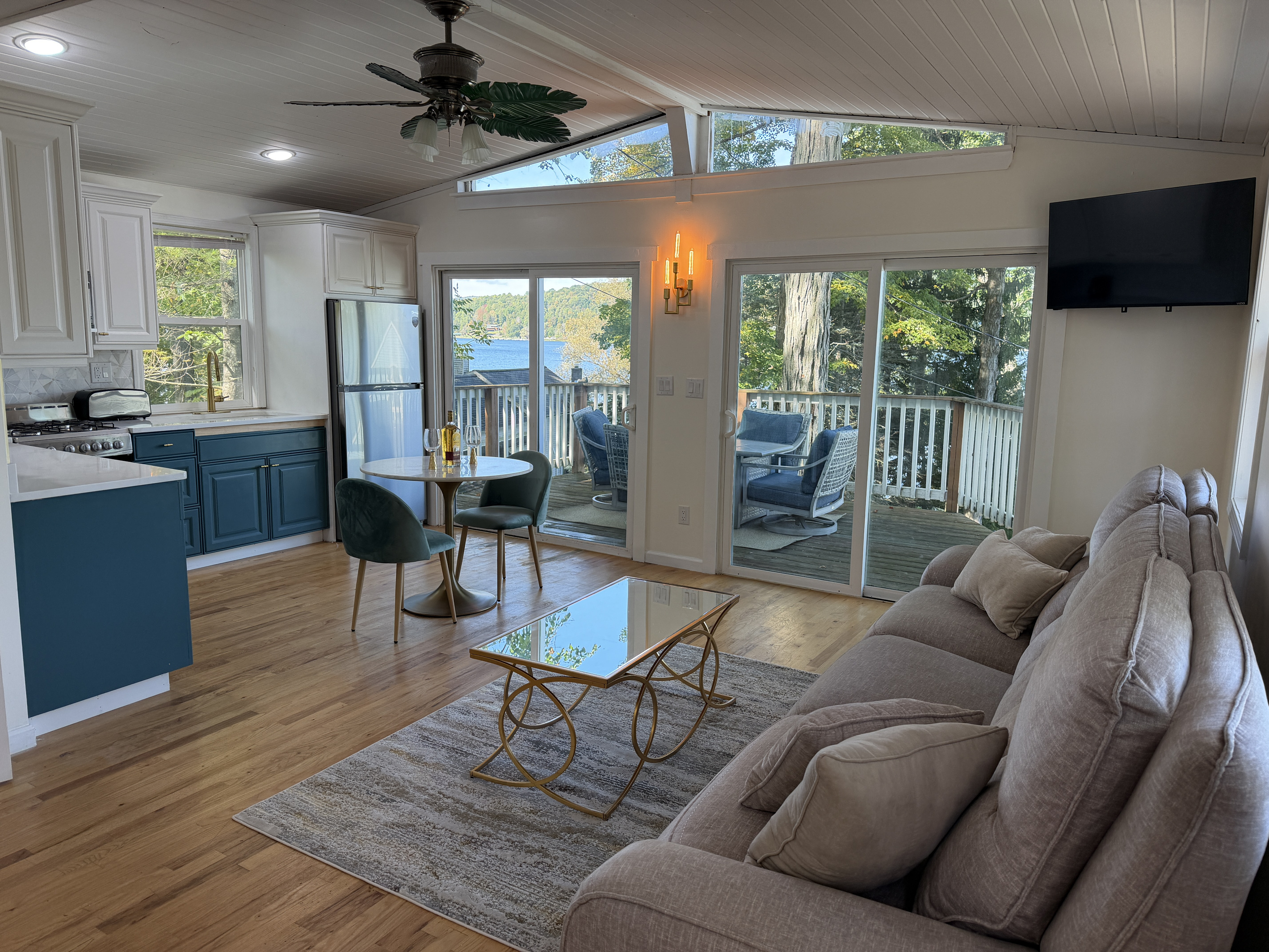 Open living/dining/kitchen and deck beyond