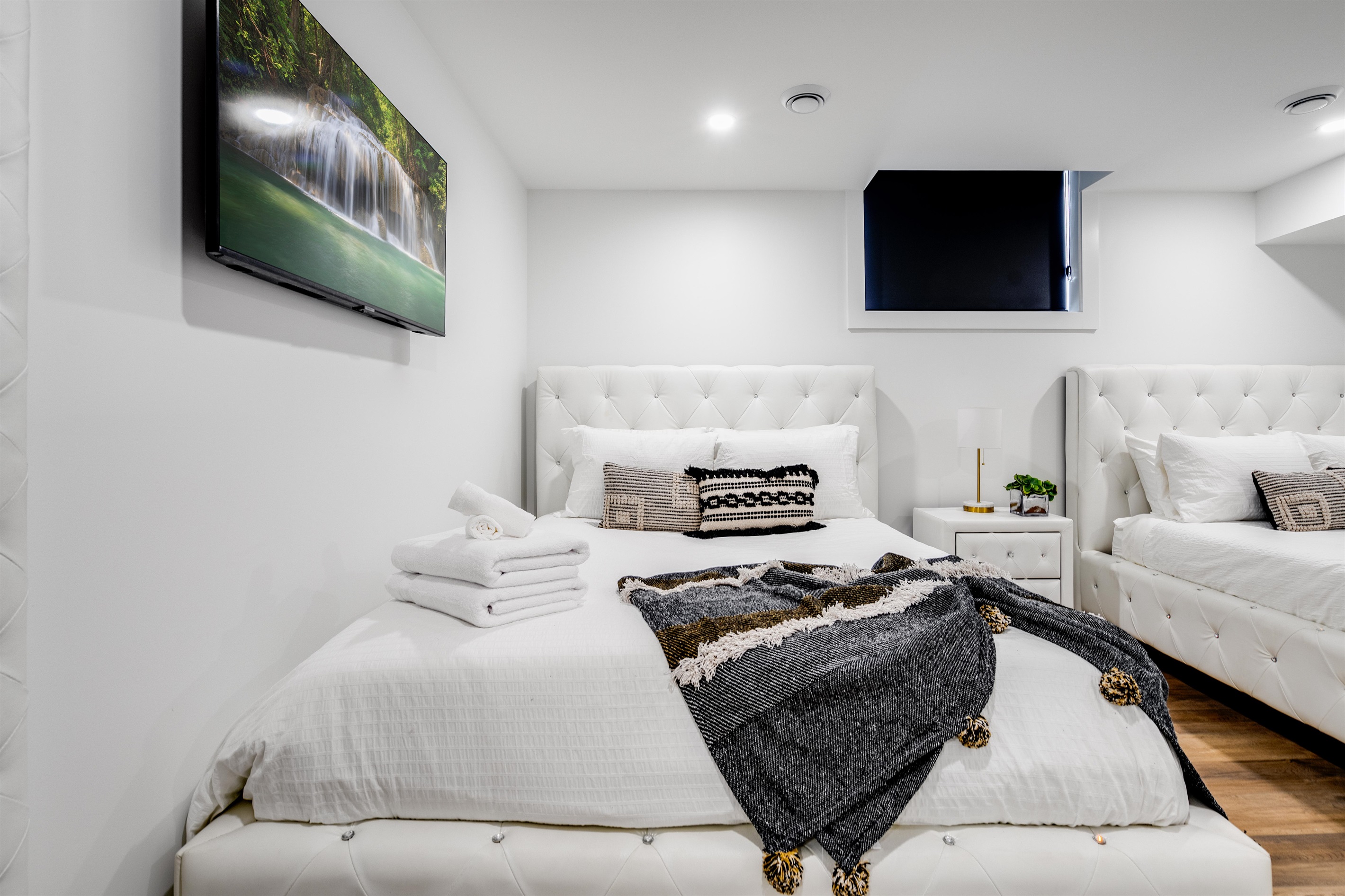 Lower level bedroom with two queen beds.