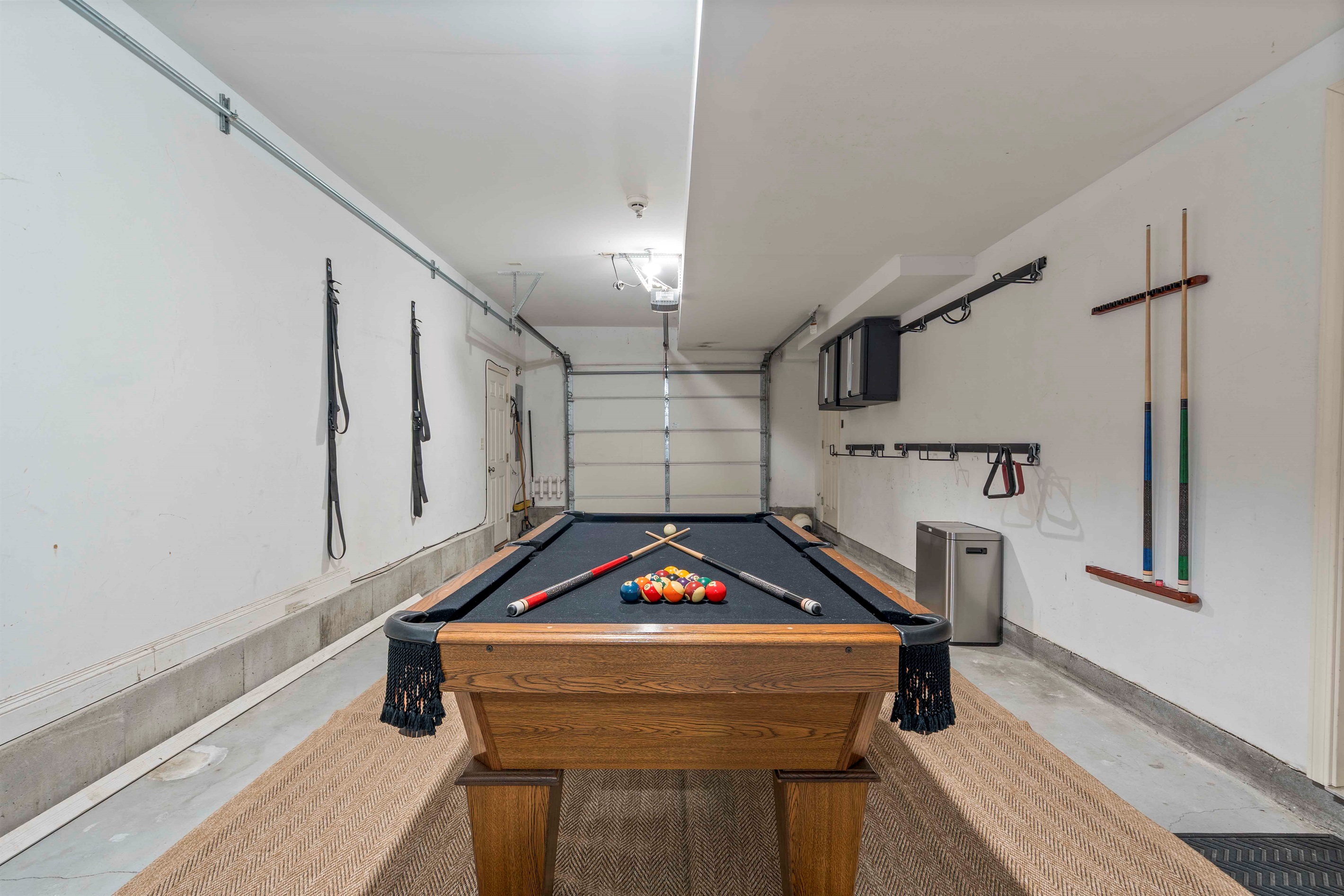 Unwind and have fun with games on the pool table, right in the garage!