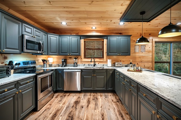Who doesn't LOVE a spacious and organized kitchen like this? Granite countertop and ample space to move about. Ready to cook a simple or full meal? Our kitchen is fully stocked with everything you can think of. Enjoy a family cooked-meal together.
