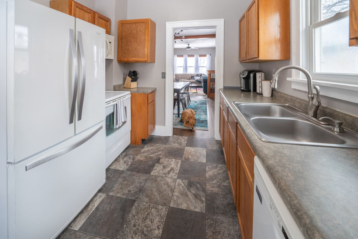 The kitchen is right off the dining + living room.