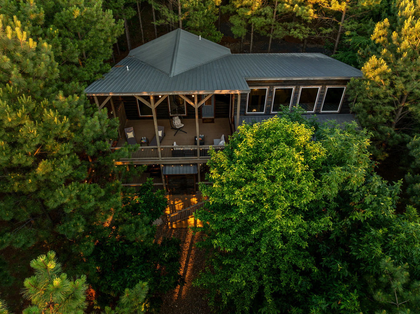 Nestled among towering pines, this secluded luxury cabin offers the perfect blend of privacy and comfort, featuring a spacious covered deck, peaceful forest views, and a true escape into nature. 🌲✨🏡