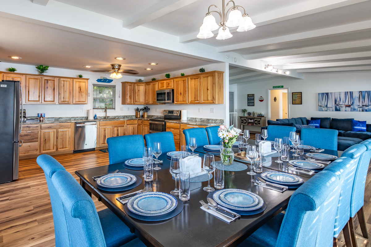 Group dining sits directly beside the kitchen, making serving meals simple and convenient.